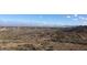 Sweeping hillside view with low lying desert plants, rolling hills and mountain range in the background at 7841 N 18Th St, Phoenix, AZ 85020