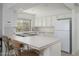 Functional kitchen with white appliances, countertops, and bright window with outdoor views at 7841 N 18Th St, Phoenix, AZ 85020