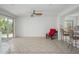 Cozy living space with white fireplace, neutral tile floors, and bright outdoor access at 7841 N 18Th St, Phoenix, AZ 85020