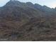 Close-up of a rugged mountain landscape, showcasing its natural textures and contours under soft, natural lighting at 7841 N 18Th St, Phoenix, AZ 85020