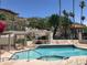 Sparkling community pool surrounded by palm trees and chaise lounges at 7841 N 18Th St, Phoenix, AZ 85020