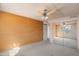 Carpeted bedroom featuring a ceiling fan, ample closet space, and natural light at 7920 E Camelback Rd # 303, Scottsdale, AZ 85251