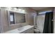 Nicely appointed bathroom featuring a new white vanity, a large mirror, and shower/tub at 846 W Straford Ave, Gilbert, AZ 85233