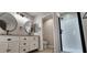 Renovated bathroom with dual mirrors, black hardware, shower, and separate toilet room at 846 W Straford Ave, Gilbert, AZ 85233