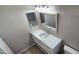 Bathroom featuring a white vanity, a large mirror, and shower/tub at 846 W Straford Ave, Gilbert, AZ 85233