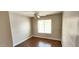 Bedroom with wood floors, overhead fan and a window with natural light at 846 W Straford Ave, Gilbert, AZ 85233