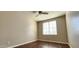 Bedroom featuring wood flooring, a ceiling fan, and natural light at 846 W Straford Ave, Gilbert, AZ 85233