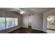 Bedroom features hardwood floors, natural light from a large window and ensuite bathroom and walk-in closet at 846 W Straford Ave, Gilbert, AZ 85233