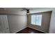 Bedroom with neutral colored walls, wood flooring, and a ceiling fan at 846 W Straford Ave, Gilbert, AZ 85233
