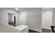 Upstairs hallway with neutral walls and trim, with dark wood flooring at 846 W Straford Ave, Gilbert, AZ 85233