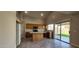 Open kitchen featuring tile floors, an island, plenty of cabinet space and stainless steel appliances at 846 W Straford Ave, Gilbert, AZ 85233