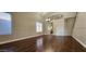 Spacious living room featuring neutral colors, large windows, hardwood floors, and access to the staircase at 846 W Straford Ave, Gilbert, AZ 85233