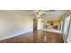 Spacious living room with hardwood floors that connects to kitchen with island at 846 W Straford Ave, Gilbert, AZ 85233