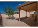 Spacious backyard with covered patio, desert landscaping, and ample room for outdoor enjoyment at 1027 W Julie Dr, Tempe, AZ 85283