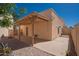Private backyard featuring a covered patio, offering a perfect space for relaxation and entertaining at 1027 W Julie Dr, Tempe, AZ 85283