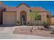 Charming single-story home featuring a well-manicured front yard and inviting covered entryway at 1027 W Julie Dr, Tempe, AZ 85283