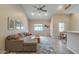 Inviting living area with tile floors, a ceiling fan, and ample seating at 1027 W Julie Dr, Tempe, AZ 85283