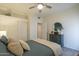 Well-lit bedroom featuring a ceiling fan, closet space, and a neutral color palette at 1027 W Julie Dr, Tempe, AZ 85283