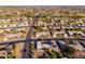 An aerial view of a neighborhood featuring single-Gathering homes, well-maintained streets, and landscaping at 10521 W Roundelay Cir, Sun City, AZ 85351