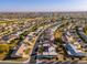 An aerial view showcasing a nice community in an open area at 10521 W Roundelay Cir, Sun City, AZ 85351