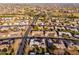 An aerial view of a neighborhood featuring single-Gathering homes, well-maintained streets, and desert landscaping at 10521 W Roundelay Cir, Sun City, AZ 85351