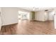 Expansive living area with built-in shelving, wood floors, and lots of natural light at 10521 W Roundelay Cir, Sun City, AZ 85351