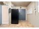 Efficient pantry space with a full-sized refrigerator and additional storage shelving and room to organize at 10521 W Roundelay Cir, Sun City, AZ 85351