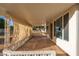 Inviting covered patio with privacy screens, offering a cozy space to unwind and enjoy the views at 10521 W Roundelay Cir, Sun City, AZ 85351