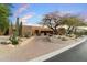 Beautiful desert home featuring native landscaping and a paver driveway for added curb appeal at 10639 E Mark Ln, Scottsdale, AZ 85262