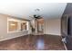 Open-concept living room with tile flooring and views to the dining room and staircase at 10649 E Lomita Ave, Mesa, AZ 85209