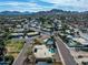 Expansive aerial view of a home in a tranquil neighborhood with mountain views and well-maintained streets at 10834 N 45Th St, Phoenix, AZ 85028
