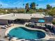 Aerial view of a backyard oasis with a pool, hot tub, outdoor dining, and lounge area perfect for entertaining at 10834 N 45Th St, Phoenix, AZ 85028