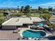 Aerial view of a backyard oasis with a pool, hot tub, outdoor dining, and lounge area perfect for entertaining at 10834 N 45Th St, Phoenix, AZ 85028