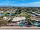 Expansive aerial view of a home with a private pool, jacuzzi, and mature desert landscaping on a corner lot at 10834 N 45Th St, Phoenix, AZ 85028