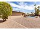 View of the backyard, showing the pool, patio, and low-maintenance gravel landscaping at 10834 N 45Th St, Phoenix, AZ 85028