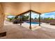 Outdoor patio area offering built-in grill, steps to the pool, and views of the sunny backyard at 10834 N 45Th St, Phoenix, AZ 85028
