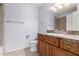 Bathroom featuring tile flooring, wood cabinetry, and well-lit vanity at 10834 N 45Th St, Phoenix, AZ 85028