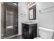 Well-lit bathroom with modern fixtures, including a glass shower, granite vanity, and tiled flooring at 10834 N 45Th St, Phoenix, AZ 85028