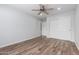 Bedroom with hard wood flooring, closet with sliding doors, and a ceiling fan at 10834 N 45Th St, Phoenix, AZ 85028