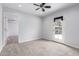 Neutral bedroom with carpet flooring, ceiling fan, and direct access to backyard at 10834 N 45Th St, Phoenix, AZ 85028