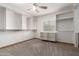 Spacious walk in closet with carpet flooring and natural light streaming through a window at 10834 N 45Th St, Phoenix, AZ 85028