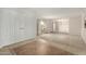 Bright foyer with a tile floor and a large white entry door, leading to a carpeted living area at 10834 N 45Th St, Phoenix, AZ 85028