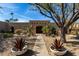 Charming desert home featuring xeriscaping, native plants, and a stone pathway to the front entrance at 10834 N 45Th St, Phoenix, AZ 85028