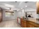 Spacious kitchen featuring granite countertops, stainless steel appliances, and a breakfast bar at 10834 N 45Th St, Phoenix, AZ 85028