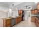 Well-lit kitchen featuring stainless appliances, tile flooring, and granite countertops at 10834 N 45Th St, Phoenix, AZ 85028