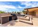 Built-in grill and hot tub create an inviting outdoor entertaining space at 10834 N 45Th St, Phoenix, AZ 85028