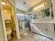 Bathroom with double sink vanity, framed mirrors, and a shower behind glass doors at 1203 W Mesquite Tree Ln, San Tan Valley, AZ 85143