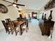 Open dining area with wood table, matching chairs, and seamless kitchen access at 1203 W Mesquite Tree Ln, San Tan Valley, AZ 85143