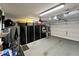 Garage with black storage cabinets, lighting, and sectional garage door at 1203 W Mesquite Tree Ln, San Tan Valley, AZ 85143