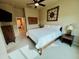 Serene bedroom with plush carpeting, ceiling fan, and neutral color scheme at 1203 W Mesquite Tree Ln, San Tan Valley, AZ 85143
